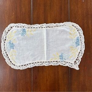 Hand-Embroidered White Linen Doily with Blue Floral Accents